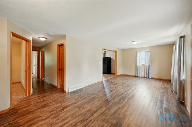 536 N Johnson St, Ada, OH 45810 - empty room featuring wood finished floors and baseboards