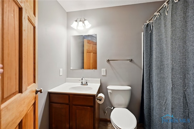 536 N Johnson St, Ada, OH 45810 - bathroom featuring vanity, toilet, and curtained shower