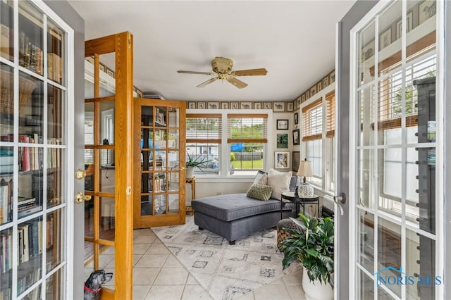 713 N Vine St, Fostoria, OH 44830 - sunroom featuring tile patterned floors, ceiling fan, and french doors