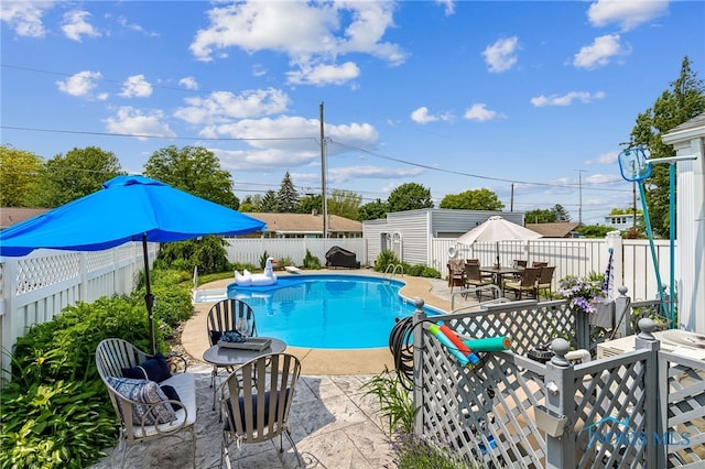 713 N Vine St, Fostoria, OH 44830 - view of pool with a fenced backyard, outdoor dining space, and a patio