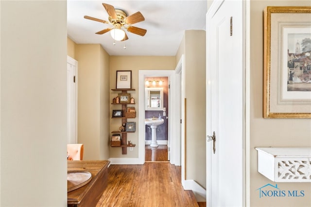 713 N Vine St, Fostoria, OH 44830 - hall featuring wood finished floors and baseboards