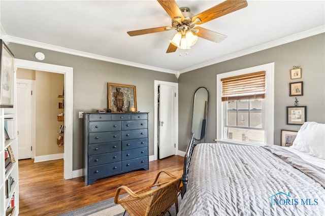 713 N Vine St, Fostoria, OH 44830 - bedroom featuring crown molding, wood finished floors, baseboards, and a ceiling fan