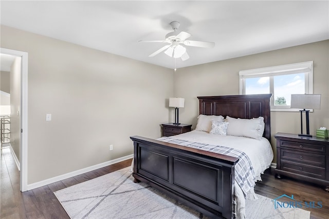 3130 Steeple Chase Ln, Perrysburg, OH 43551 - bedroom with dark wood-style floors, baseboards, and ceiling fan