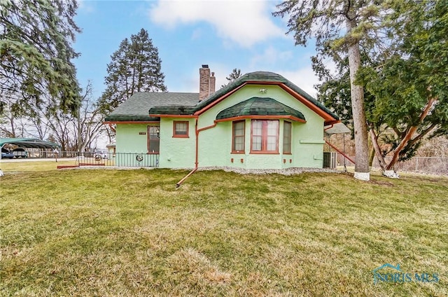 7149 Wales Rd, Northwood, OH 43619 - back of house with a chimney, a carport, stucco siding, and cooling unit