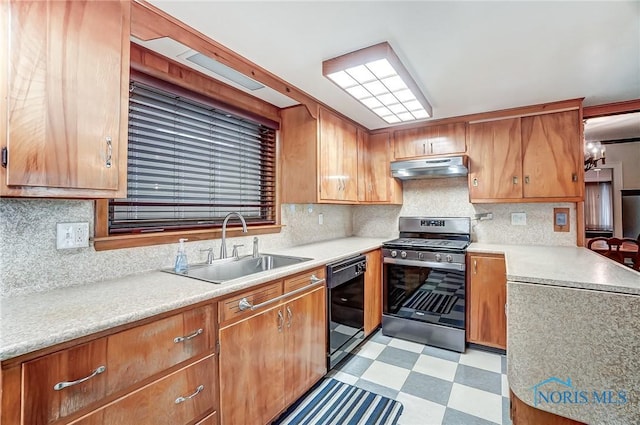 7149 Wales Rd, Northwood, OH 43619 - kitchen with stainless steel range with gas cooktop, dishwasher, under cabinet range hood, a sink, and light flooring