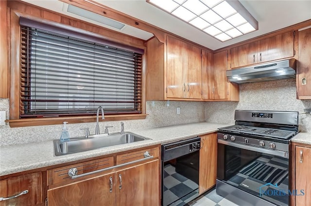 7149 Wales Rd, Northwood, OH 43619 - kitchen with stainless steel gas range, dishwasher, under cabinet range hood, a sink, and light countertops