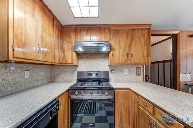 7149 Wales Rd, Northwood, OH 43619 - kitchen featuring gas range, under cabinet range hood, light countertops, and brown cabinets
