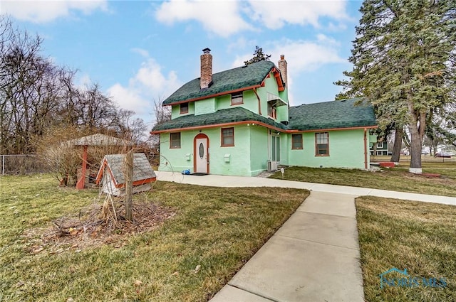 7149 Wales Rd, Northwood, OH 43619 - view of front of house with a chimney and stucco siding