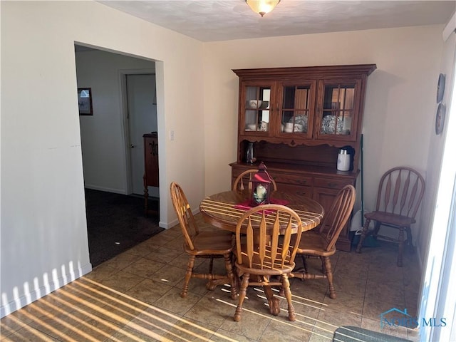 V-437 State Route 108, Napoleon, OH 43545 - dining space with tile patterned flooring and baseboards