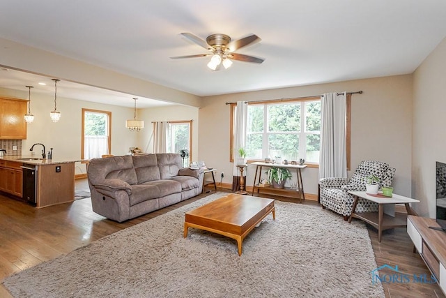 11023 Bay Trace Dr, Perrysburg, OH 43551 - living area with ceiling fan, wood finished floors, and baseboards