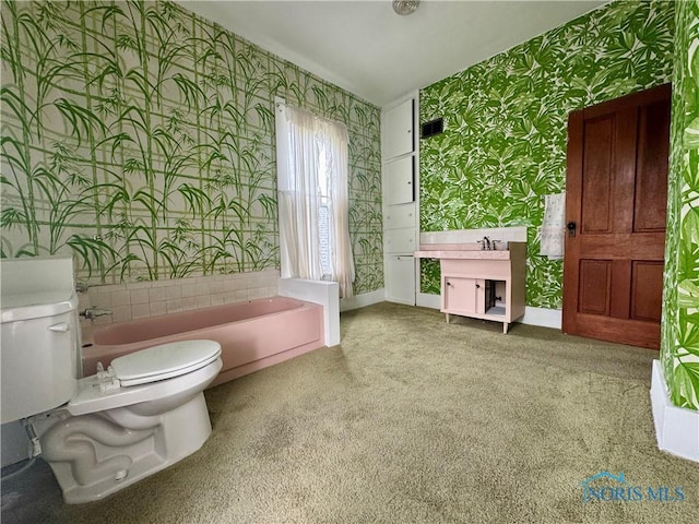 308 S Main St, Hicksville, OH 43526 - full bath with wallpapered walls, a bath, and carpet floors