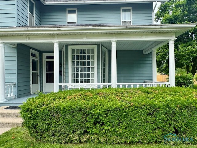 308 S Main St, Hicksville, OH 43526 - view of property exterior with a porch