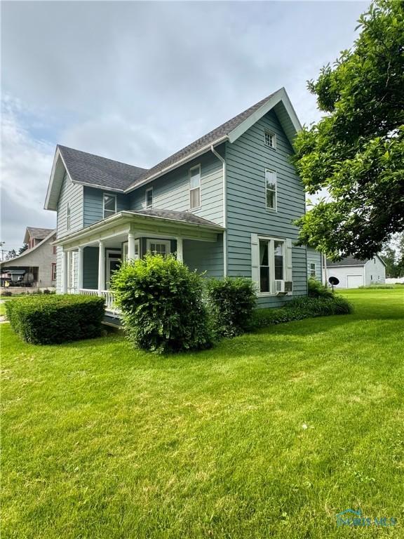 308 S Main St, Hicksville, OH 43526 - view of side of property with a lawn
