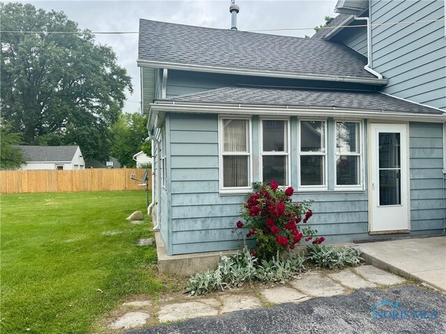 308 S Main St, Hicksville, OH 43526 - view of side of home with roof with shingles