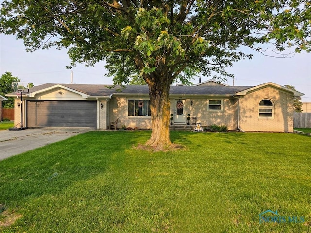 808 W St, Archbold, OH 43502 - ranch-style house featuring an attached garage, concrete driveway, and brick siding