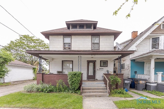 815 Dunwood Ct, Toledo, OH 43609 - american foursquare style home with a porch and a shingled roof
