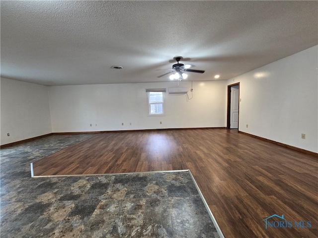 711 Circle Dr, Fostoria, OH 44830 - unfurnished room with a ceiling fan, wood finished floors, and a textured ceiling