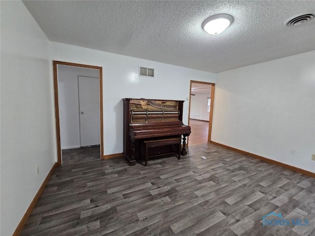711 Circle Dr, Fostoria, OH 44830 - sitting room featuring wood finished floors and a textured ceiling