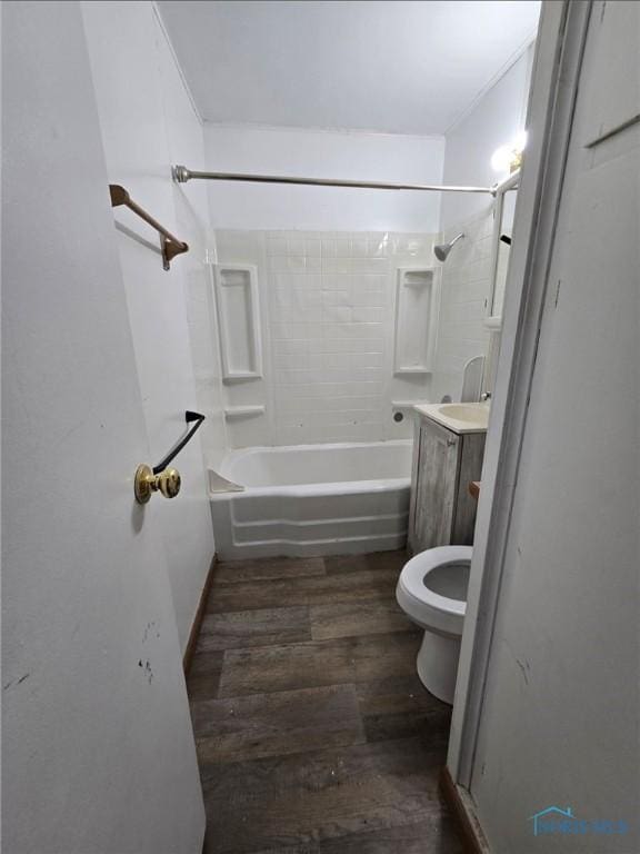 711 Circle Dr, Fostoria, OH 44830 - full bath with hardwood / wood-style flooring, shower / washtub combination, and vanity