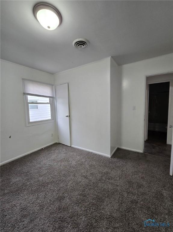 711 Circle Dr, Fostoria, OH 44830 - empty room with carpet flooring