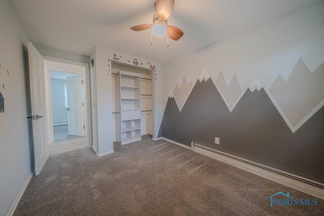 3849 Sylvanwood Dr, Sylvania, OH 43560 - unfurnished bedroom with carpet flooring, a baseboard heating unit, baseboards, ceiling fan, and a closet