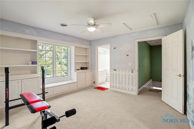 16890 W River Rd, Bowling Green, OH 43402 - workout area with light colored carpet, attic access, ceiling fan, and built in shelves
