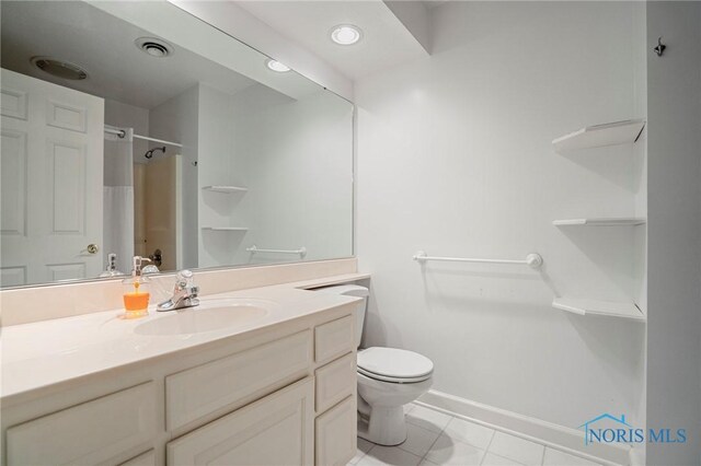 16890 W River Rd, Bowling Green, OH 43402 - full bath with vanity, a shower, toilet, tile patterned flooring, and baseboards