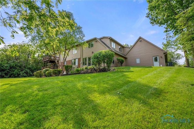 16890 W River Rd, Bowling Green, OH 43402 - view of grassy yard with central air condition unit