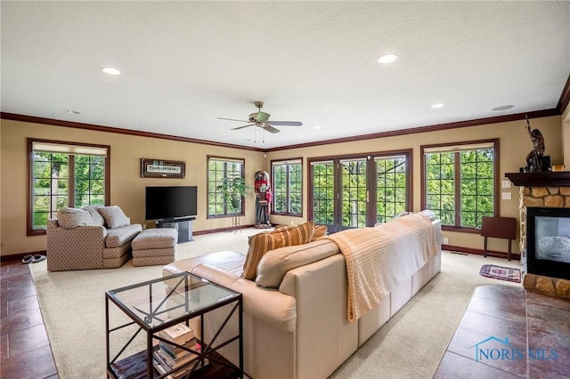 16890 W River Rd, Bowling Green, OH 43402 - living area featuring baseboards, recessed lighting, a fireplace, crown molding, and ceiling fan