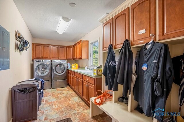 16890 W River Rd, Bowling Green, OH 43402 - washroom featuring cabinet space, washing machine and clothes dryer, electric panel, and light stone finish floors