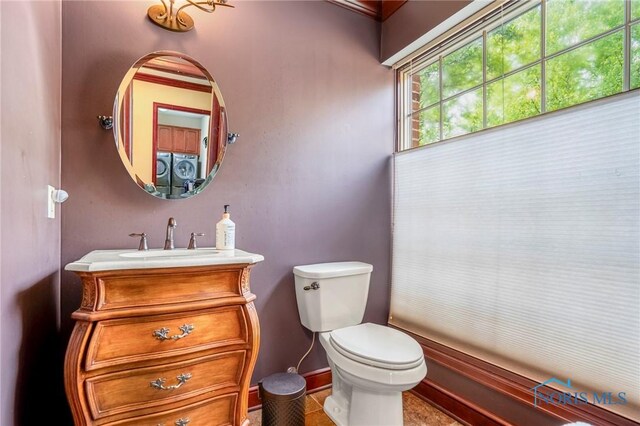 16890 W River Rd, Bowling Green, OH 43402 - half bath featuring toilet, baseboards, and vanity