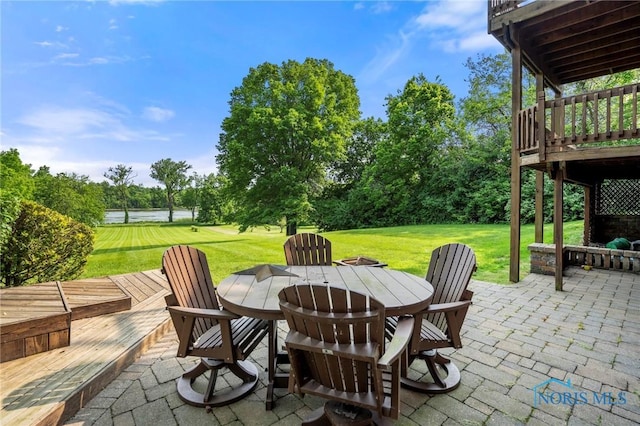 16890 W River Rd, Bowling Green, OH 43402 - view of patio / terrace with outdoor dining area, view of scattered trees, and a deck with water view