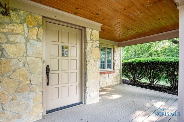 16890 W River Rd, Bowling Green, OH 43402 - doorway to property featuring stone siding