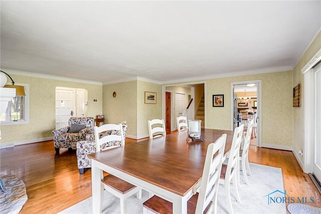 16890 W River Rd, Bowling Green, OH 43402 - dining area with stairway and light wood-type flooring
