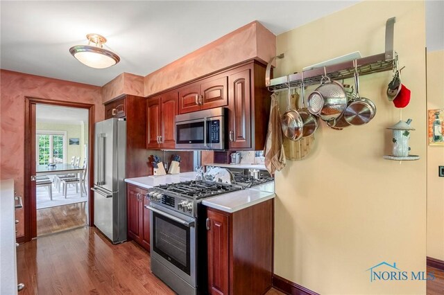 16890 W River Rd, Bowling Green, OH 43402 - kitchen with appliances with stainless steel finishes, dark wood finished floors, and light countertops