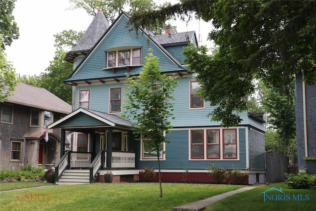 2238 Scottwood Ave, Toledo, OH 43620 - view of front facade with a porch and a front lawn
