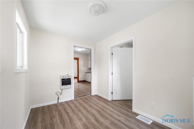 230 W S St, Fostoria, OH 44830 - unfurnished room with heating unit and wood finished floors