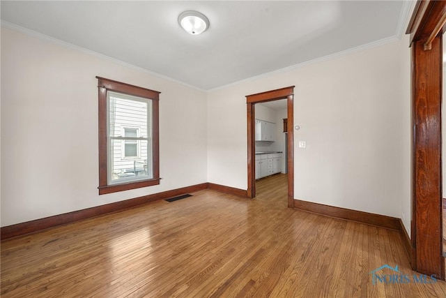 230 W S St, Fostoria, OH 44830 - unfurnished room with wood finished floors and ornamental molding