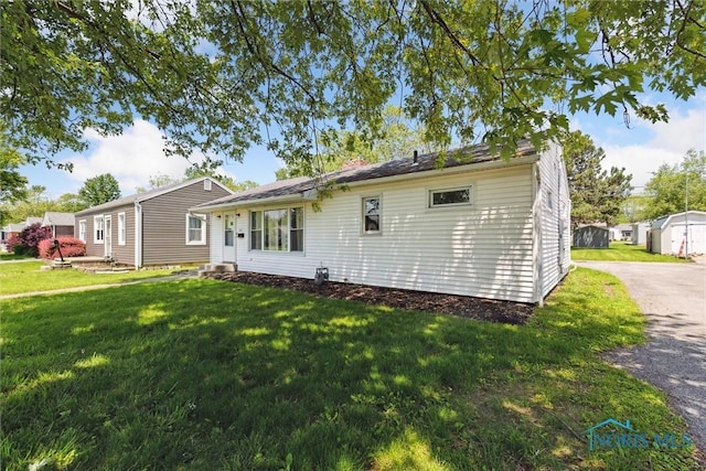 308 Edith Ave, Findlay, OH 45840 - back of property featuring a yard and a chimney