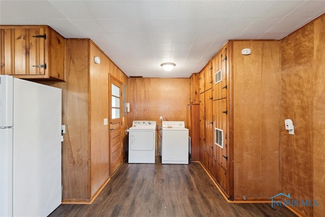 308 Edith Ave, Findlay, OH 45840 - washroom featuring washer and dryer, dark wood finished floors, and wooden walls