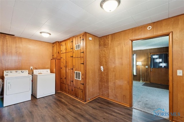 308 Edith Ave, Findlay, OH 45840 - laundry area featuring washing machine and dryer, wooden walls, and wood finished floors