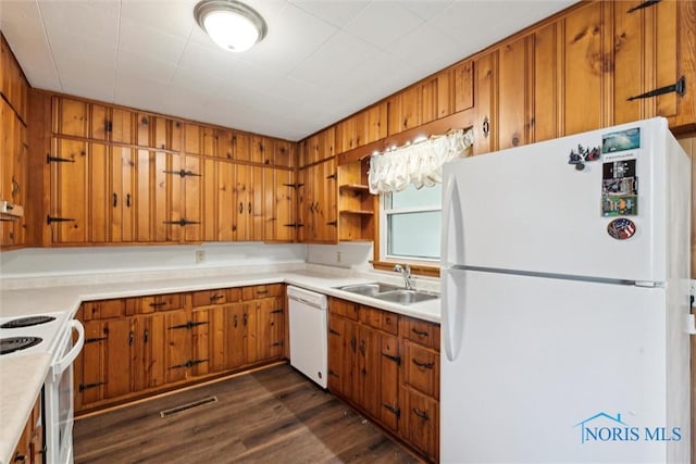 308 Edith Ave, Findlay, OH 45840 - kitchen with white appliances, a sink, brown cabinets, light countertops, and dark wood-style flooring