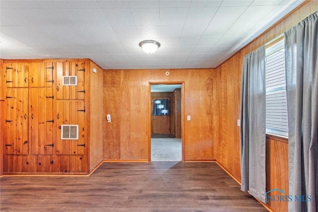 308 Edith Ave, Findlay, OH 45840 - spare room with wood finished floors, wood walls, and baseboards