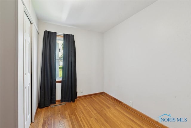 308 Edith Ave, Findlay, OH 45840 - unfurnished room with light wood finished floors and baseboards