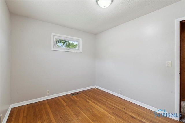 308 Edith Ave, Findlay, OH 45840 - empty room featuring baseboards and wood finished floors