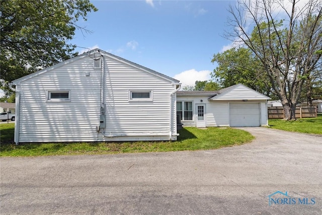 308 Edith Ave, Findlay, OH 45840 - view of home's exterior with a garage and driveway