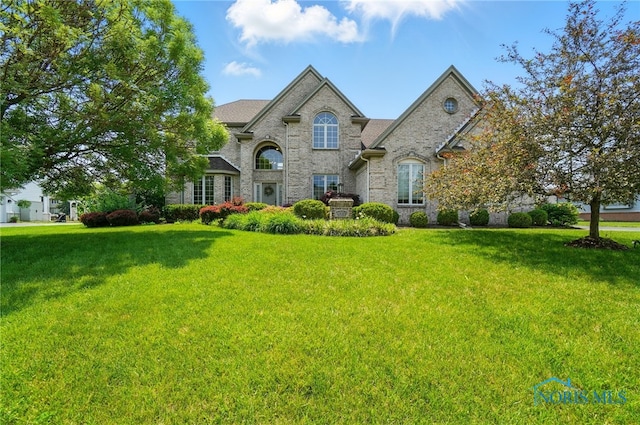 7433 Valhalla Dr, Maumee, OH 43537 - french country home featuring a front yard