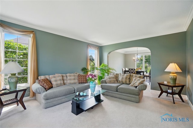 7433 Valhalla Dr, Maumee, OH 43537 - living area featuring arched walkways, carpet floors, ornamental molding, and a chandelier