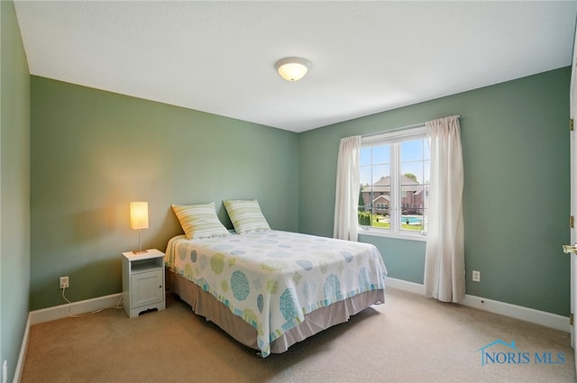 7433 Valhalla Dr, Maumee, OH 43537 - bedroom with light carpet and baseboards