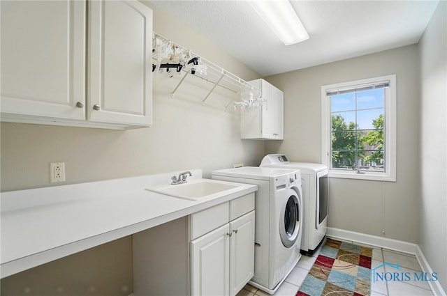 7433 Valhalla Dr, Maumee, OH 43537 - washroom featuring cabinet space, independent washer and dryer, baseboards, and light tile patterned floors